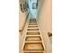 Carpeted staircase leads to the upper level, illuminated by natural light and adorned with framed pictures at 1320 Stanley Park Dr # 141, Decatur, GA 30033
