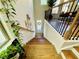 Bright staircase leads to the upper level with a view of the dining area and lush greenery outside at 1320 Stanley Park Dr # 141, Decatur, GA 30033