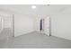 Finished basement space featuring durable flooring, white walls, and multiple doorways at 4205 Mabry Ne Rd, Roswell, GA 30075