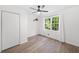 Bedroom featuring a ceiling fan, closet and natural light from a window at 4205 Mabry Ne Rd, Roswell, GA 30075