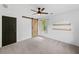 Bedroom featuring a ceiling fan, a sliding barn door and natural light from the window at 4205 Mabry Ne Rd, Roswell, GA 30075