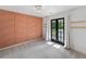 Bedroom featuring carpeted floors, an accent wall and french doors to a balcony at 4205 Mabry Ne Rd, Roswell, GA 30075