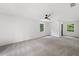 Spacious bedroom with carpeted floors, ceiling fan and two windows at 4205 Mabry Ne Rd, Roswell, GA 30075