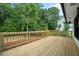 Spacious wooden deck with railing offering a great view of the yard and lush greenery at 4205 Mabry Ne Rd, Roswell, GA 30075