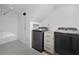 Bright laundry room is equipped with modern washer and dryer at 4205 Mabry Ne Rd, Roswell, GA 30075