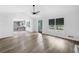 Bright open-concept living room with a kitchen view and access to an outdoor patio at 4205 Mabry Ne Rd, Roswell, GA 30075