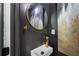 Stylish powder room featuring modern fixtures, elegant mirror, and chic decor at 4205 Mabry Ne Rd, Roswell, GA 30075