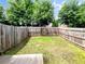 Enclosed backyard with full wood fence, green lawn, and mature trees creating a private outdoor space at 4922 Longview Walk, Decatur, GA 30035