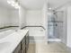 Stylish bathroom features a double sink vanity, soaking tub, and separate shower with marble-style tile at 4922 Longview Walk, Decatur, GA 30035
