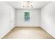 Bright bedroom with a modern ceiling light and a window with blinds at 4922 Longview Walk, Decatur, GA 30035