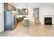 Modern kitchen with stainless steel appliances, gray cabinets, central island, and a view of the staircase at 4922 Longview Walk, Decatur, GA 30035
