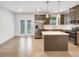 Modern kitchen featuring stainless steel appliances, a center island, and sleek gray cabinets at 4922 Longview Walk, Decatur, GA 30035