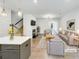 Bright living room features an electric fireplace, hardwood floors, and a comfortable seating area at 4922 Longview Walk, Decatur, GA 30035
