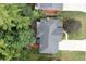 Aerial view of home with gray roof, deck, and hot tub, bordered by mature trees and meticulous landscaping at 4957 Day Lily Nw Way, Acworth, GA 30102