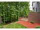 Backyard featuring a landscaped yard, wooden fence and lush trees at 4957 Day Lily Nw Way, Acworth, GA 30102