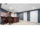 Basement featuring a wooden bar with seating and multiple doorways at 4957 Day Lily Nw Way, Acworth, GA 30102
