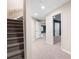 Finished basement with carpeted stairs and a doorway leading to another room at 4957 Day Lily Nw Way, Acworth, GA 30102