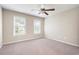 Spacious bedroom with neutral carpet, ceiling fan and large windows for plenty of light at 4957 Day Lily Nw Way, Acworth, GA 30102