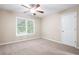 Bedroom features neutral carpet, light walls, ceiling fan and bright natural light at 4957 Day Lily Nw Way, Acworth, GA 30102