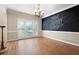Dining room features chalkboard wall, modern lighting, and hardwood floors at 4957 Day Lily Nw Way, Acworth, GA 30102