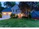 Charming home with lush landscaping and a well-manicured lawn at 4957 Day Lily Nw Way, Acworth, GA 30102