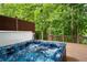 Hot tub on wooden deck with wooded views at 4957 Day Lily Nw Way, Acworth, GA 30102
