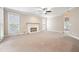 Spacious living room with neutral carpet, fireplace, and neutral paint at 4957 Day Lily Nw Way, Acworth, GA 30102