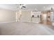 Open-concept living room leads to the kitchen and features neutral carpet and paint at 4957 Day Lily Nw Way, Acworth, GA 30102