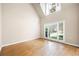 Room features hardwood floors, large windows, and neutral paint at 4957 Day Lily Nw Way, Acworth, GA 30102