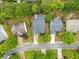 An aerial view showcases the home, highlighting its roof, landscaping, and neighborhood surroundings from above at 613 Wiley Ct, Canton, GA 30115