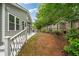 Landscaped backyard with partial fence, patio area, and outdoor kitchen; perfect for relaxing or entertaining guests at 613 Wiley Ct, Canton, GA 30115