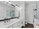 Elegant bathroom features double vanity, modern fixtures, and a glass-enclosed shower at 613 Wiley Ct, Canton, GA 30115