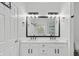 Elegant bathroom features double vanity, modern fixtures, and a glass-enclosed shower at 613 Wiley Ct, Canton, GA 30115