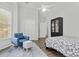 Bright bedroom featuring a ceiling fan, sitting area, luxury vinyl floors, and a closet at 613 Wiley Ct, Canton, GA 30115