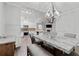 Open dining area with modern lighting and open view to the kitchen and living room at 613 Wiley Ct, Canton, GA 30115
