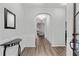 Bright entryway with beautiful flooring, a dark wood front door, and decorative wainscoting at 613 Wiley Ct, Canton, GA 30115