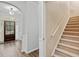 An entryway featuring hardwood floors, a staircase and a view of the front door at 613 Wiley Ct, Canton, GA 30115