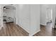 Hallway with a view into the living room and a doorway into a bathroom at 613 Wiley Ct, Canton, GA 30115