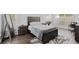 Spacious main bedroom with neutral decor, wood-look flooring and lots of natural light at 613 Wiley Ct, Canton, GA 30115