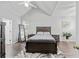 Spacious main bedroom with vaulted ceiling, neutral decor, and hardwood flooring at 613 Wiley Ct, Canton, GA 30115