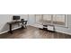 Home office featuring luxury vinyl floors, a window and a modern desk at 613 Wiley Ct, Canton, GA 30115