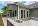 Outdoor kitchen featuring granite countertop, sink, and stone base, offering a luxurious cooking area in the backyard at 613 Wiley Ct, Canton, GA 30115