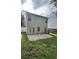 Backyard featuring a patio area accessible from the house with green space at 143 Ilex Dr, Canton, GA 30114