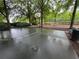 Community basketball court surrounded by trees and a walking path at 143 Ilex Dr, Canton, GA 30114