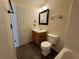 Clean bathroom featuring a vanity with storage, a framed mirror, and a shower-tub combo at 143 Ilex Dr, Canton, GA 30114