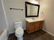 Full bathroom with dark tile floor, toilet, bath tub, and vanity with mirror at 143 Ilex Dr, Canton, GA 30114