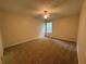 Bedroom with carpet, ceiling fan, and a window with blinds at 143 Ilex Dr, Canton, GA 30114