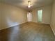 Spacious carpeted bedroom with a ceiling fan and closet access for organized storage at 143 Ilex Dr, Canton, GA 30114