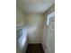 Walk-in closet featuring carpet, shelving, and neutral paint at 143 Ilex Dr, Canton, GA 30114