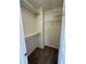 Walk-in closet featuring carpet, shelving, and neutral paint at 143 Ilex Dr, Canton, GA 30114